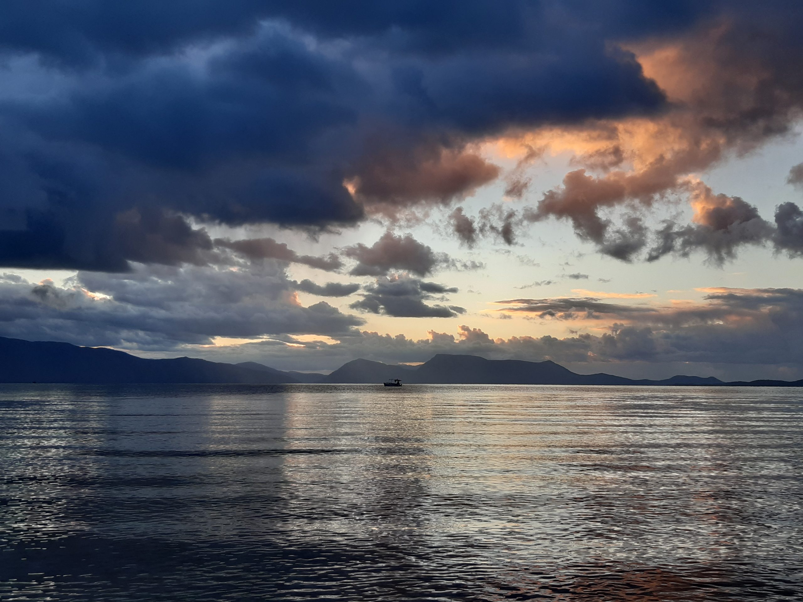 Sometimes the world feels heavy and cloudy, but look closely and there's the hope boat