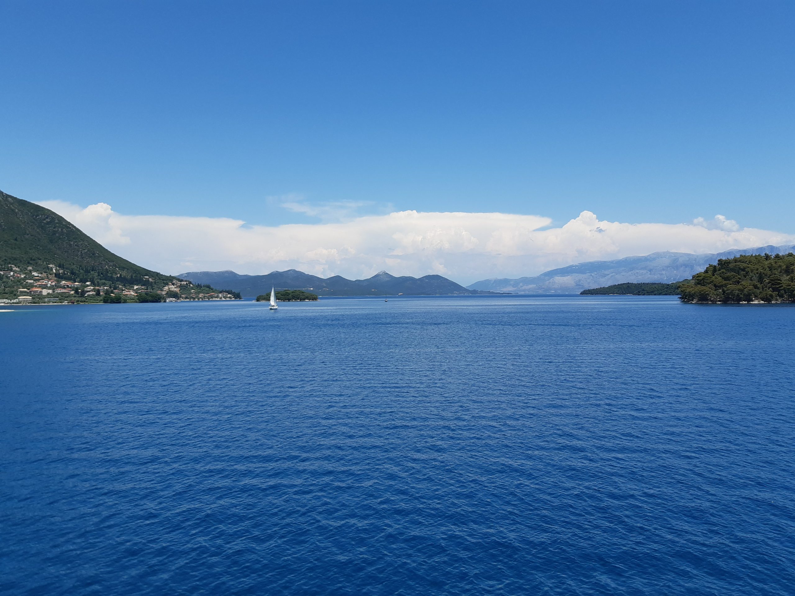 Drift away to a Greek paradise with the bluest of seas. Ideal imagery for relaxation.